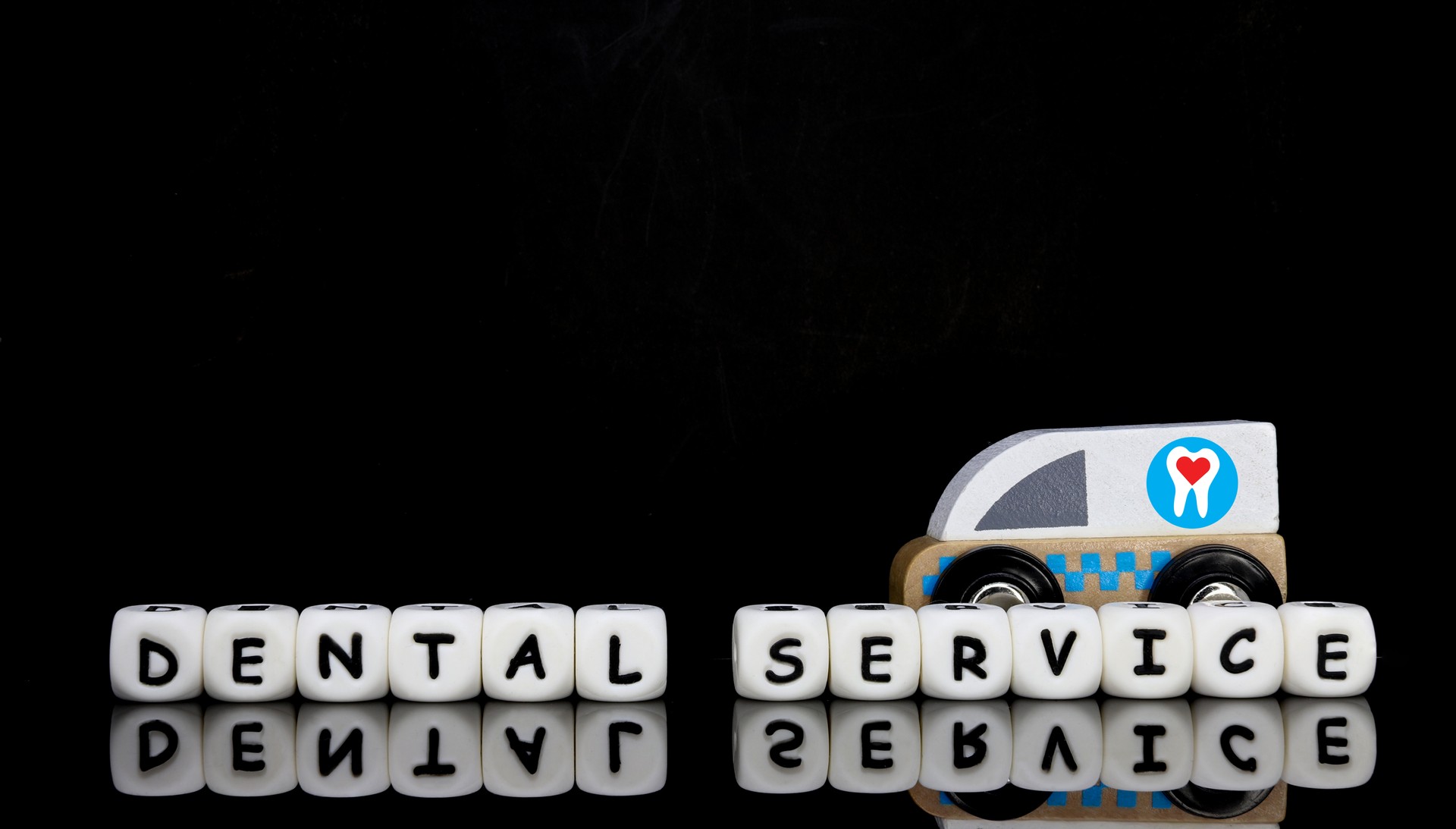 Alphabet letters spelling a word dental service